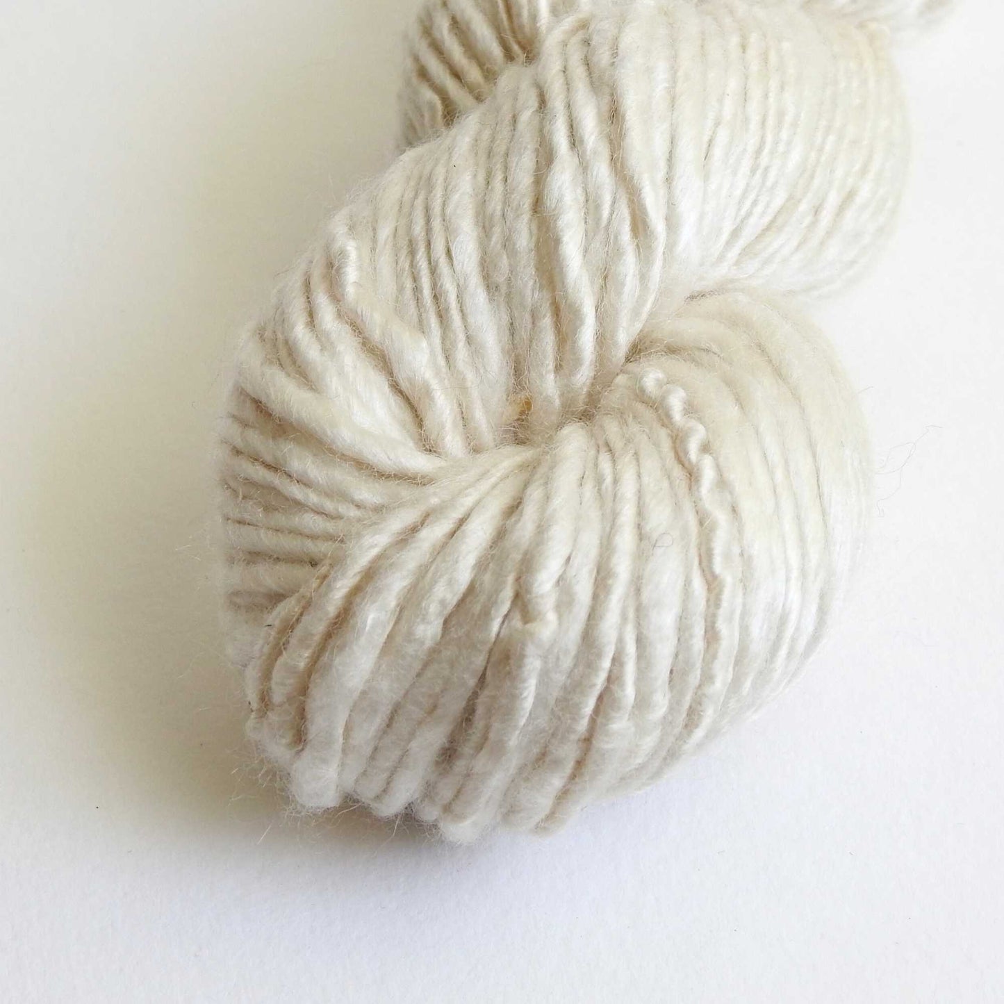 a skein of bamboo yarn in natural. a vegan yarn which is ideal for knitting, weaving, crochet & craft. soft bamboo yarn