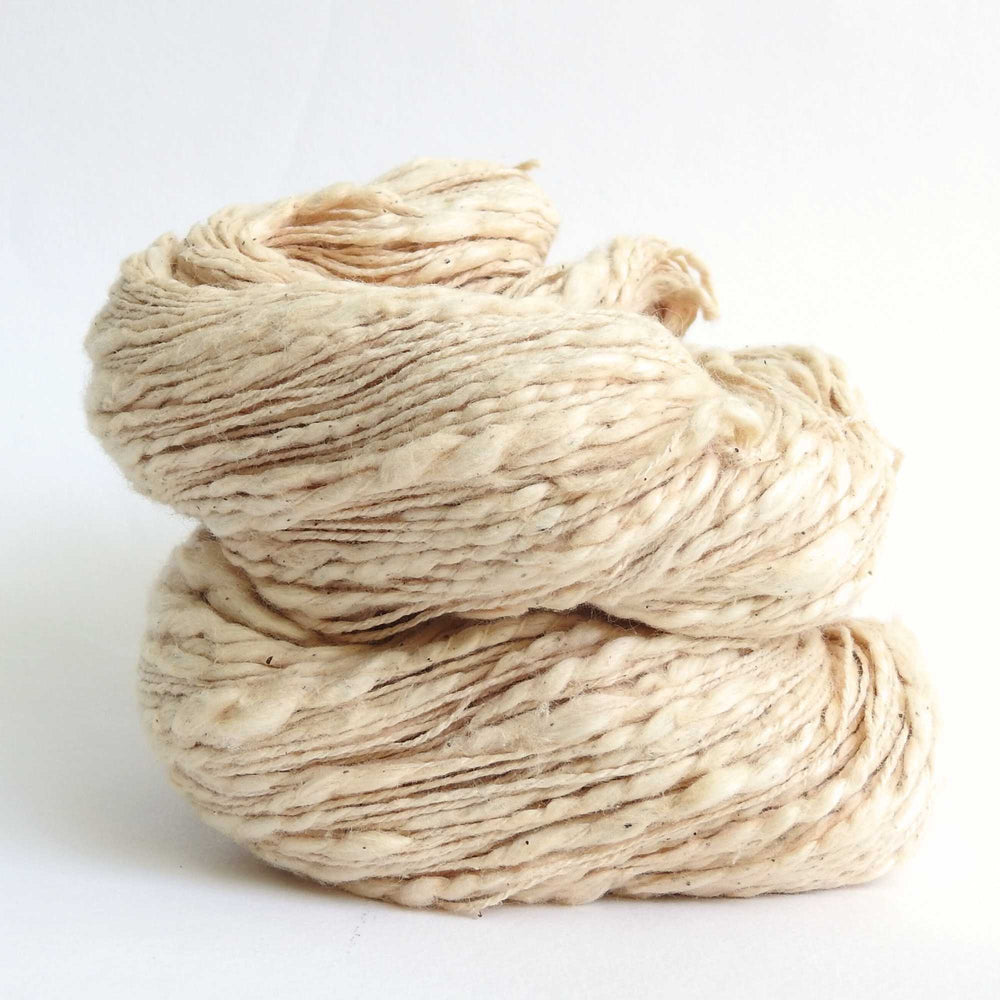 
                  
                    Skein of organic natural Cotton yarn. Cotton yarn is super soft with a slight slub for texture. Cotton knitting yarn Australia in Sand. For knitting, weaving and crochet
                  
                
