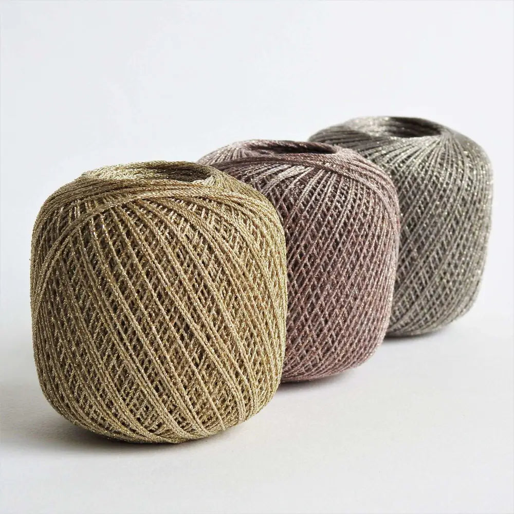 Balls of metallic yarn in bronze, gold and black. Glitter yarn, soft and shiny yarn with beautiful drape. Lurex metallic yarn for crochet, knitting, tatting, weaving, tassels and embroidery. Daruma Lurex Lame Leaf thread