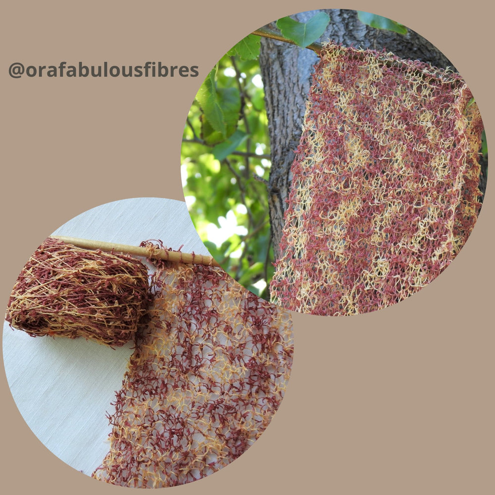 Long scarf knitted in garter stitch using Habu Textiles Double Kasuri Paper Moire yarn in Terracotta
