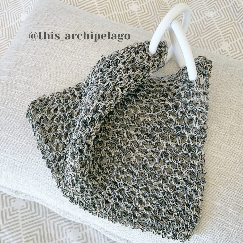 Crochet Bag Using Habu Tsumugi Wrapped Silk Cord in Sesami. Bag crafted by @this_archipelago. Habu Textiles Wrapped Tsumugi Silk A-111