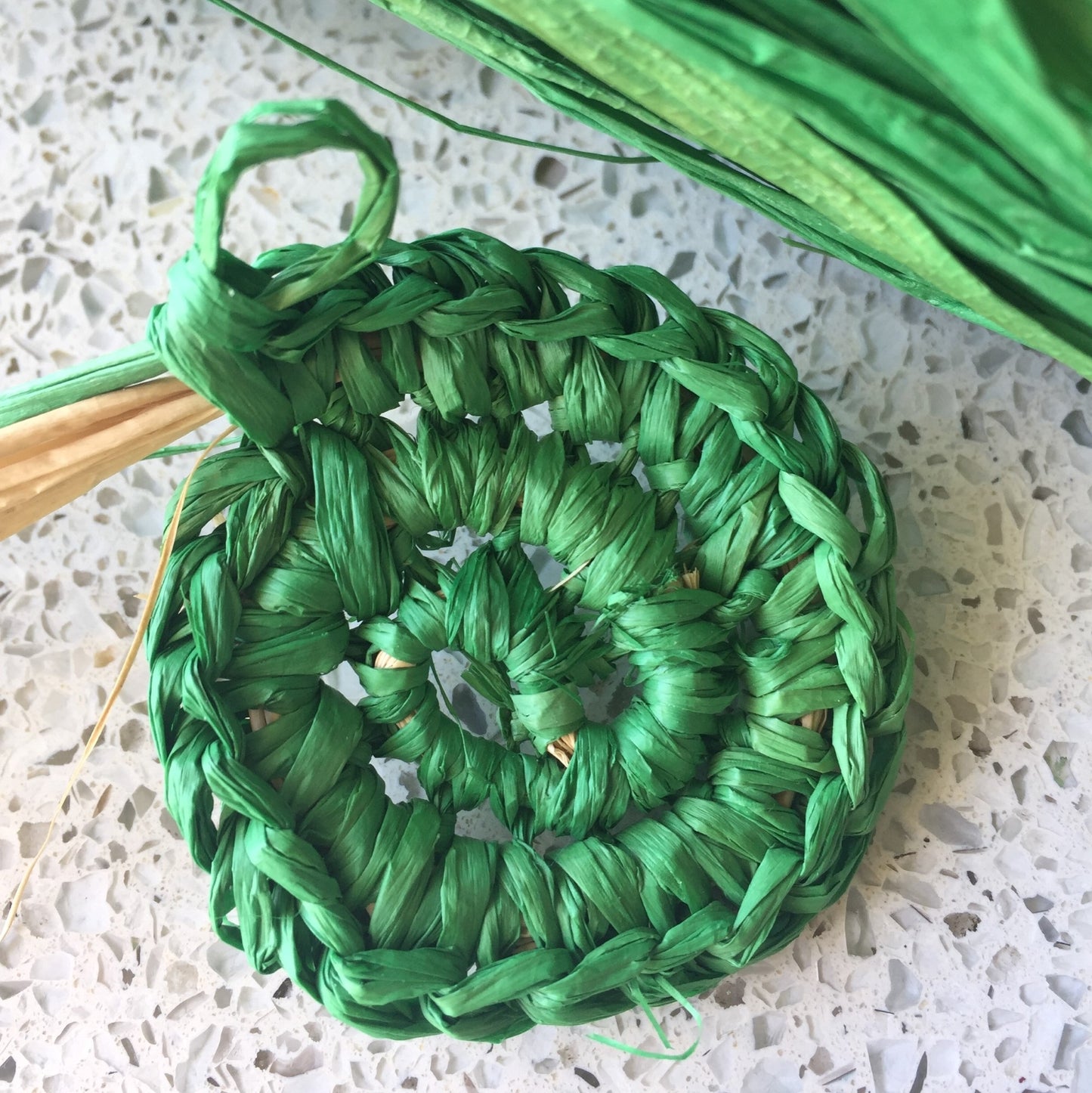 girls hat crocheted using daruma raffia yarn in green
