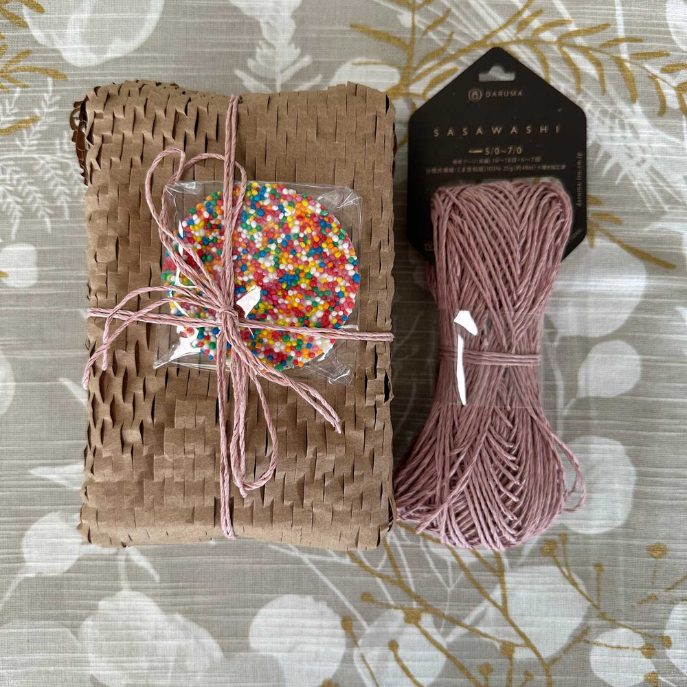Gift wrapping idea using hex paper and sasawashi bamboo paper yarn. Natural, reusuable and sustainable gift wrapping supplies for christmas, birthday and celebrations