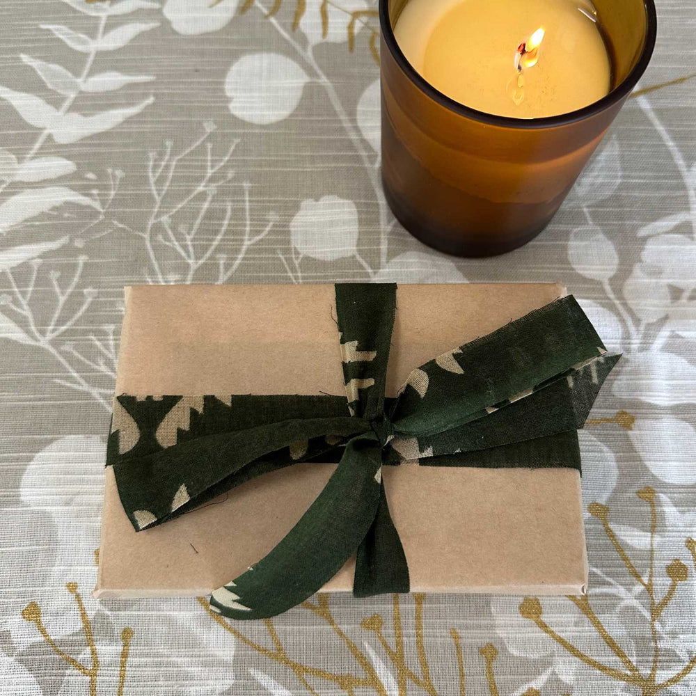 Gift wrapping idea using kraft paper and upcycled sari ribbon trim. Natural, reusuable and sustainable gift wrapping supplies for christmas, birthday and celebrations