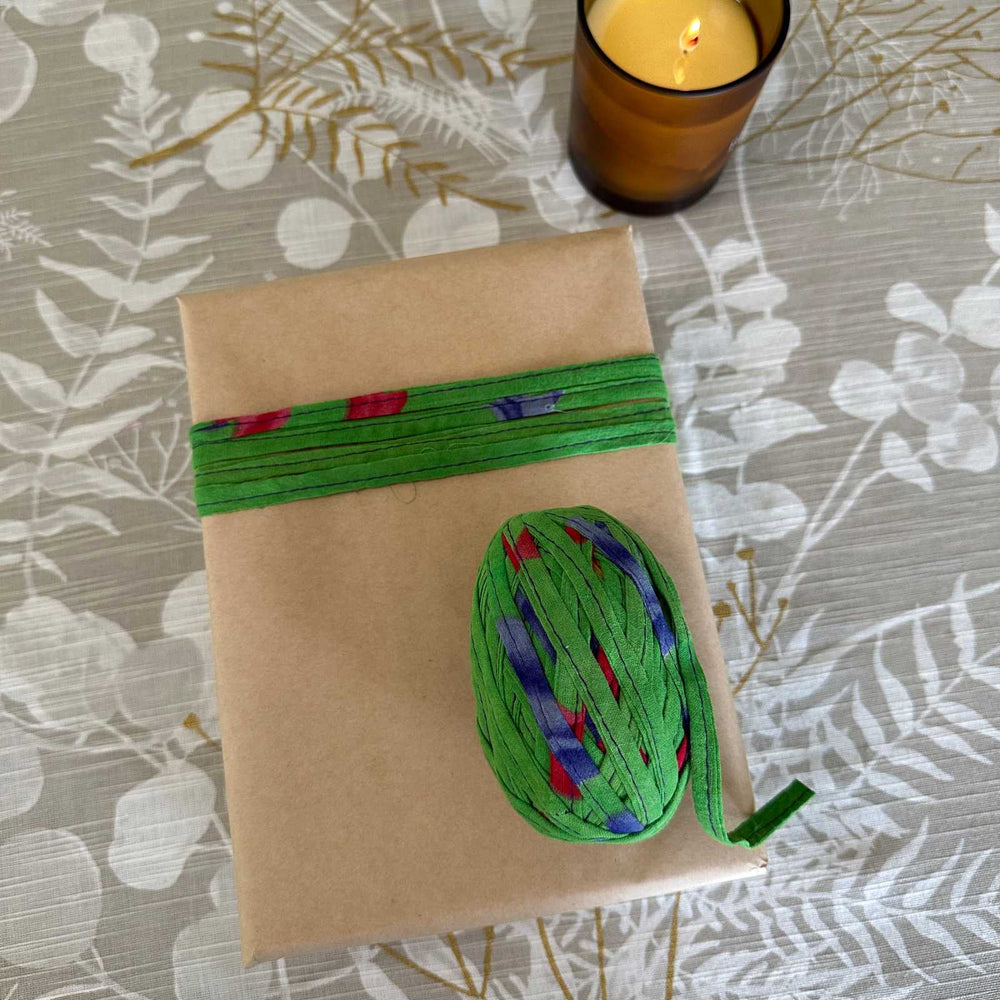 Gift wrapping idea using kraft paper and upcycled sari tape trim. Natural, reusuable and sustainable gift wrapping supplies for christmas, birthday and celebrations