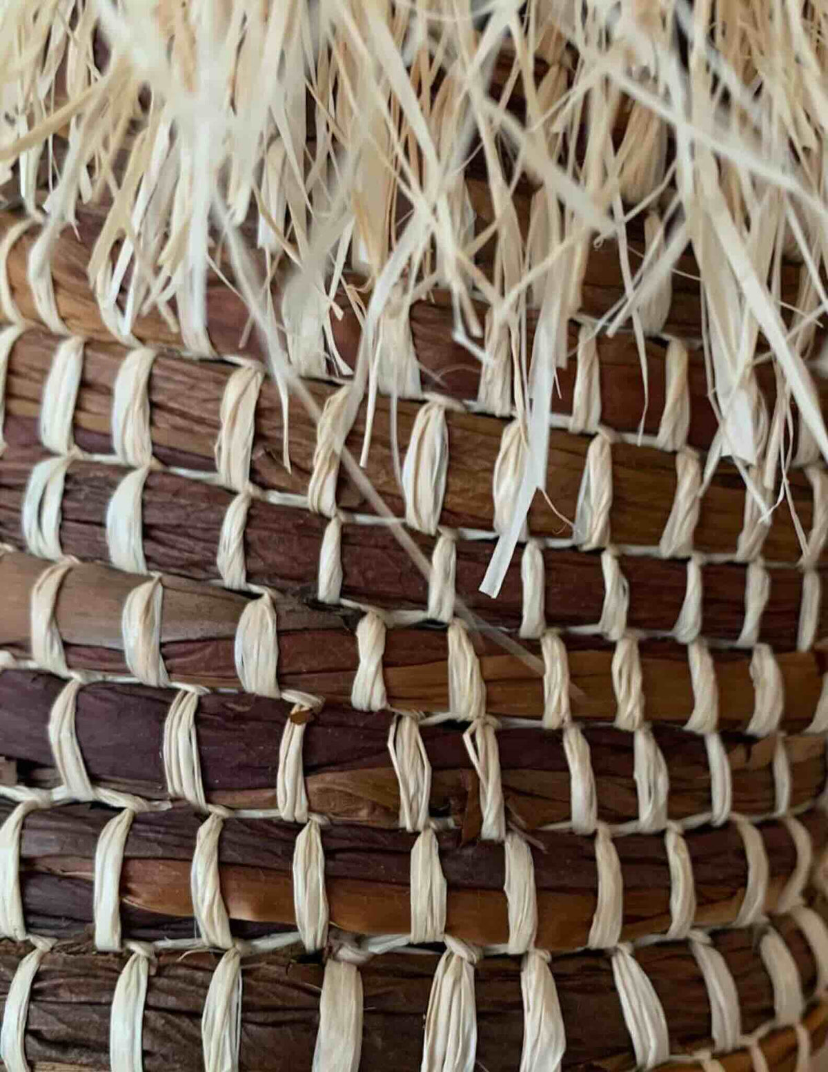 Detail of a woven work with Raffia by Lou Nade