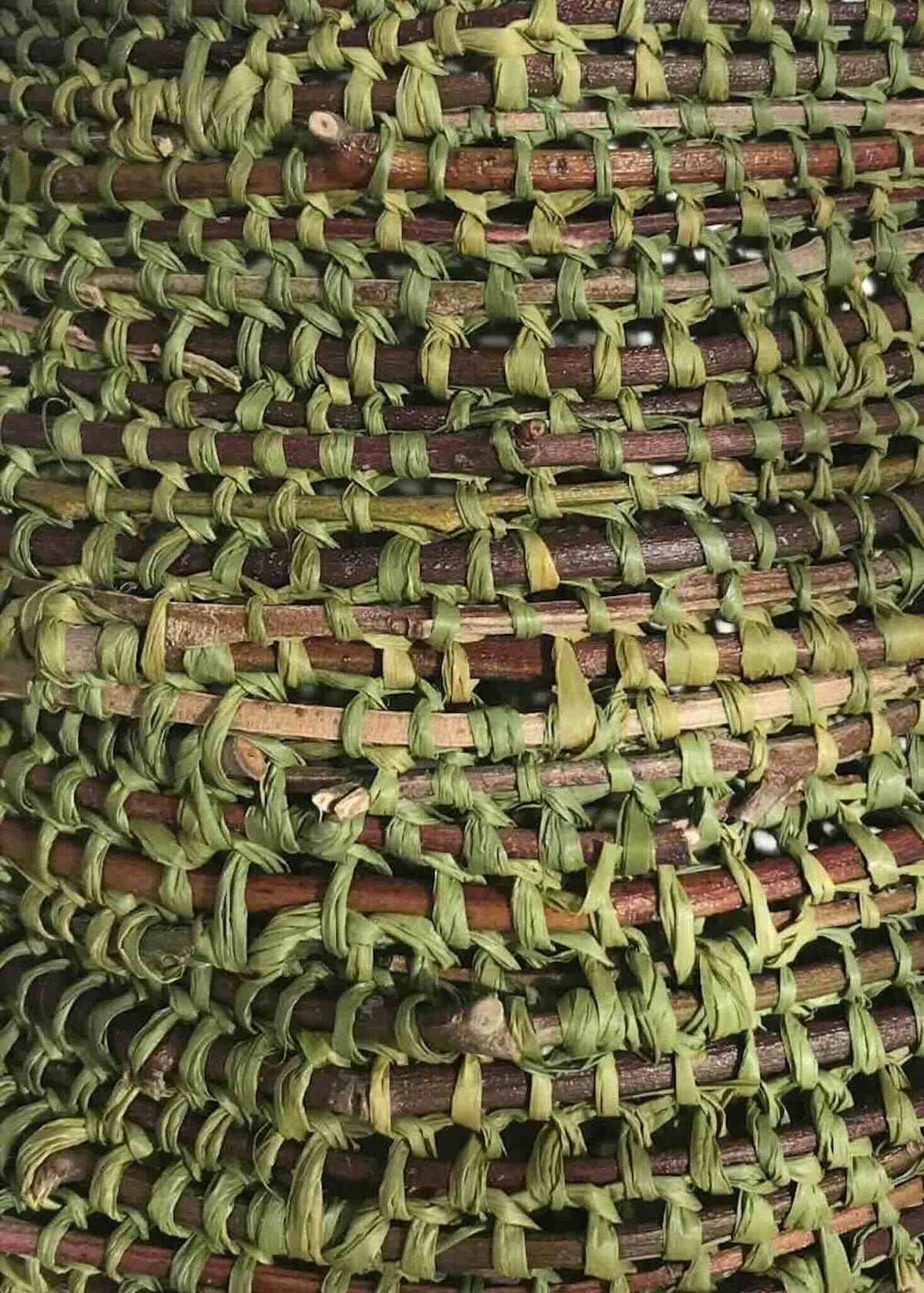 Detail of a weaving using twigs and Raffia from Ora Fabulous Fibres