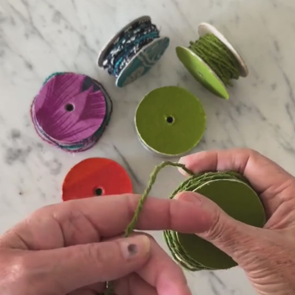 
                      
                        Load and play video in Gallery viewer, spool of upcycled cotton wire in green being twisted and pulled to show the flexibility and pliability of the craft wire.
                      
                    