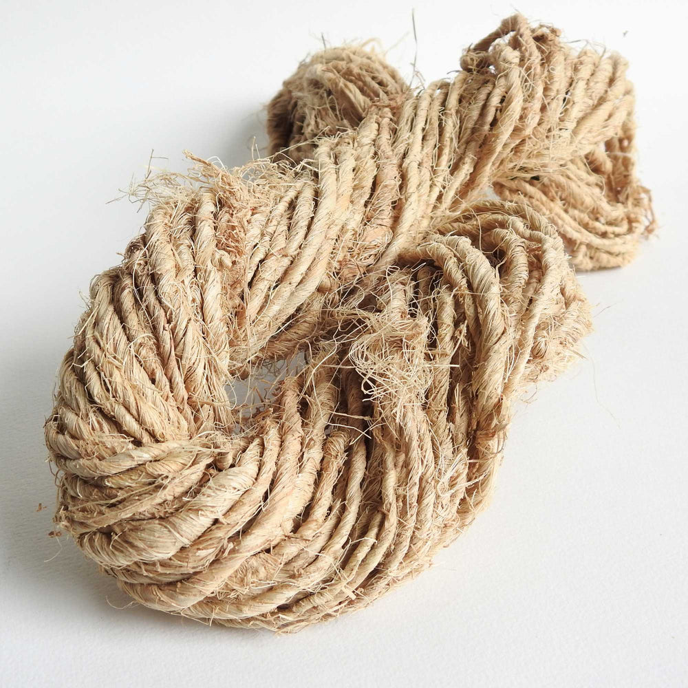 a skein of natural and unprocessed banana yarn. Raw Banana yarn which is handspun and great for baskets, weaving, mats