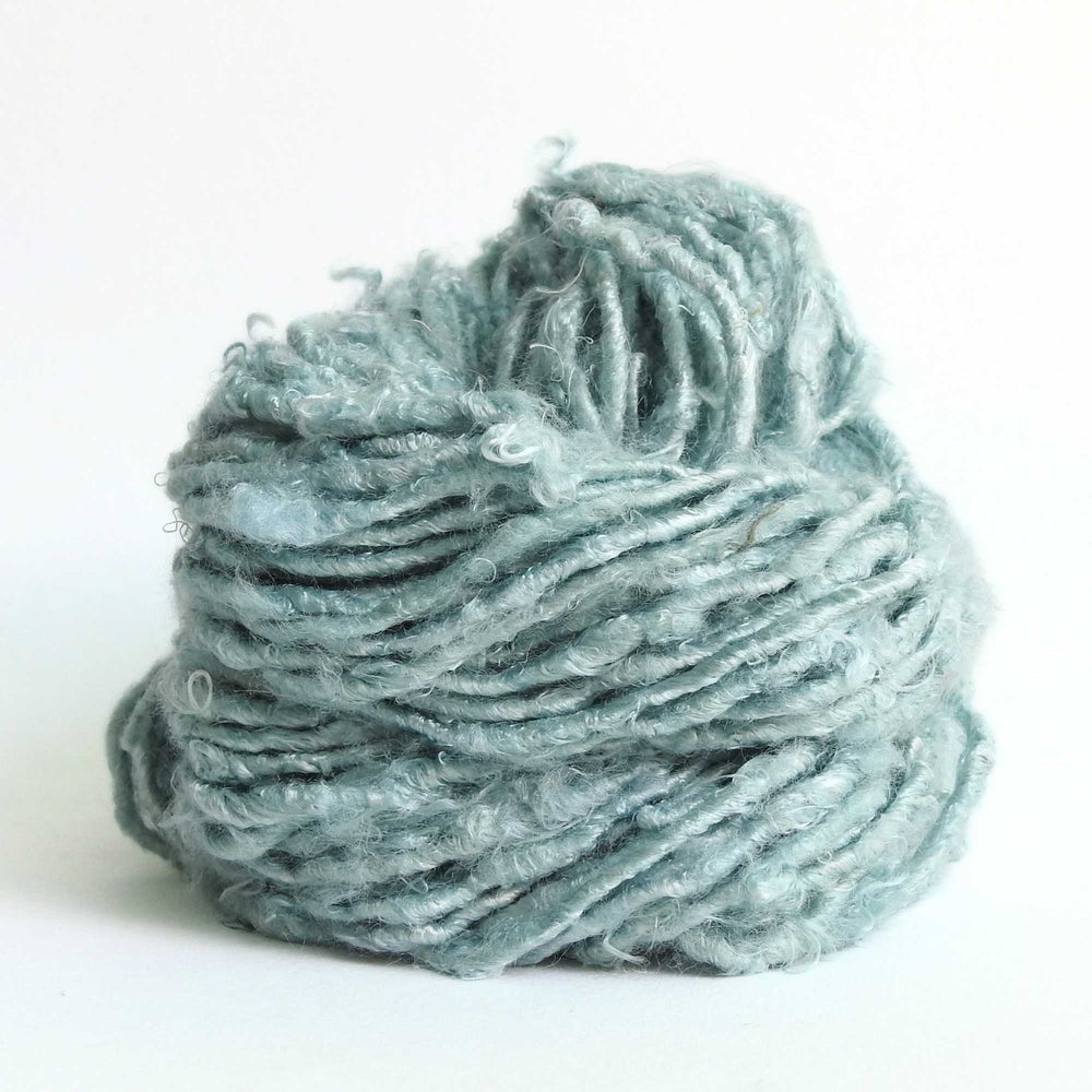 
                      
                        A ball of Banana Silk Yarn in Sage. Natural, vegan banana fiber yarn for weaving, punch needle, knitting, crochet. Soft, squishy, chunky yarn.
                      
                    