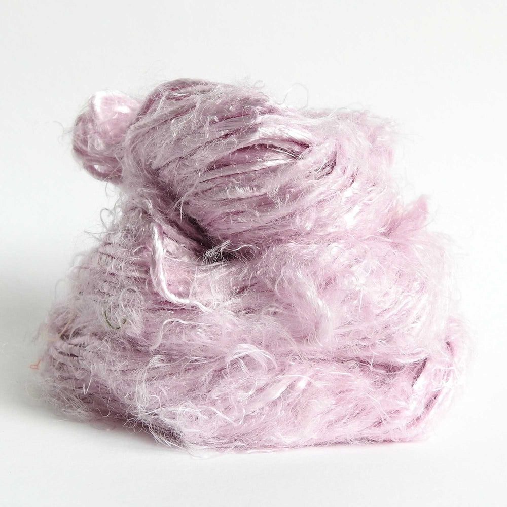 
                  
                    A ball of Banana Silk Yarn in Pixie. Natural, vegan banana fiber yarn for weaving, punch needle, knitting, crochet. Soft, squishy, chunky yarn.
                  
                