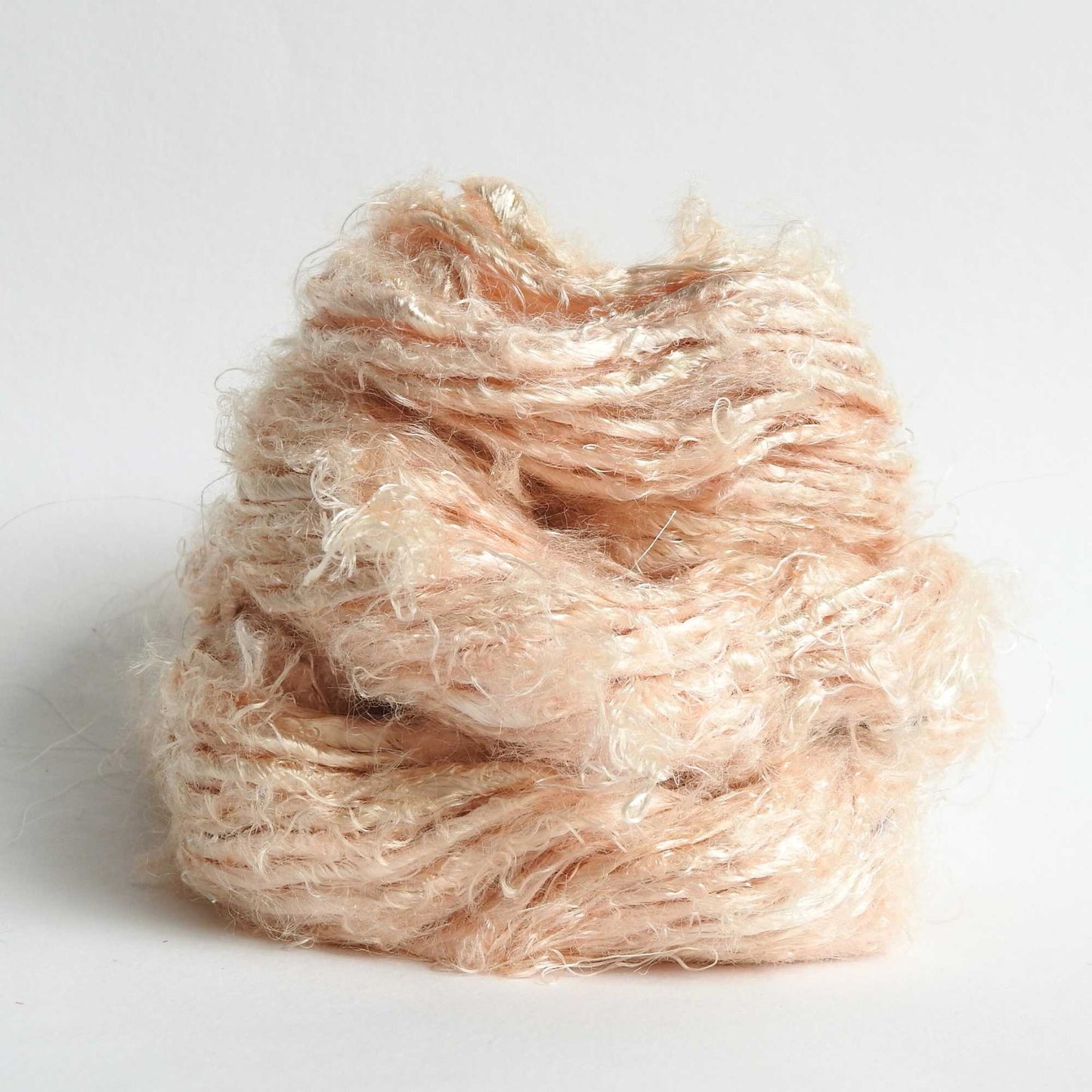 
                  
                    A ball of Banana Silk Yarn in Toasted Almond. Natural, vegan banana fiber yarn for weaving, punch needle, knitting, crochet. Soft, squishy, chunky yarn.
                  
                