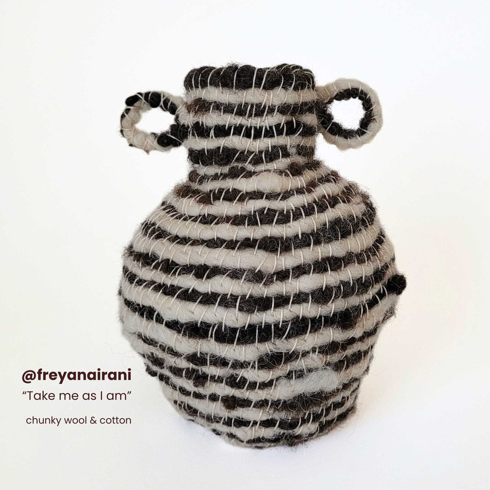
                  
                    handwoven vase by @reyanairani incorporating chunky handspun wool and  cotton yarns
                  
                