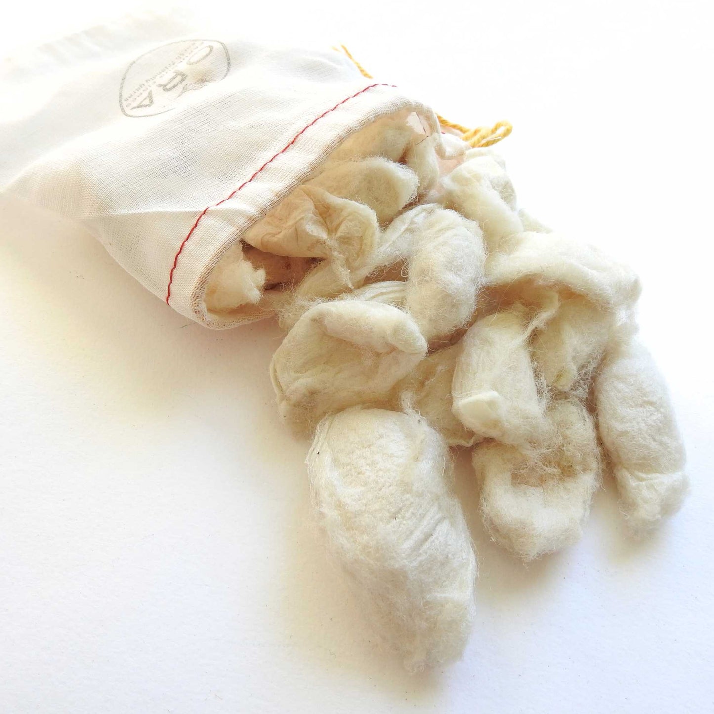 eri white silk cocoons for stitching, mixed media, felting, collage, dyeing, jewellery. cruelty free silk. sustainable