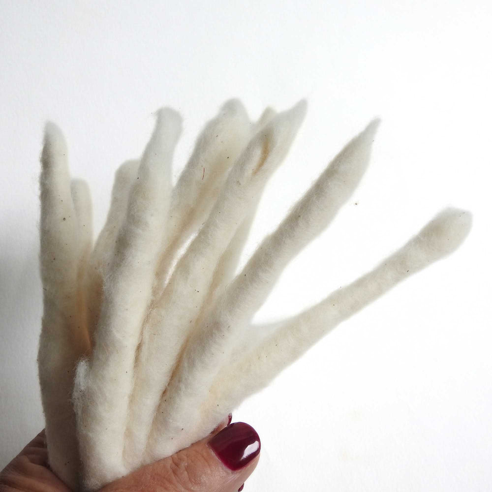bundle of handspun cotton rolls.  perfect for fibre artists, textile artists, spinning. can be dyed. traditionally known as cotton poonies.