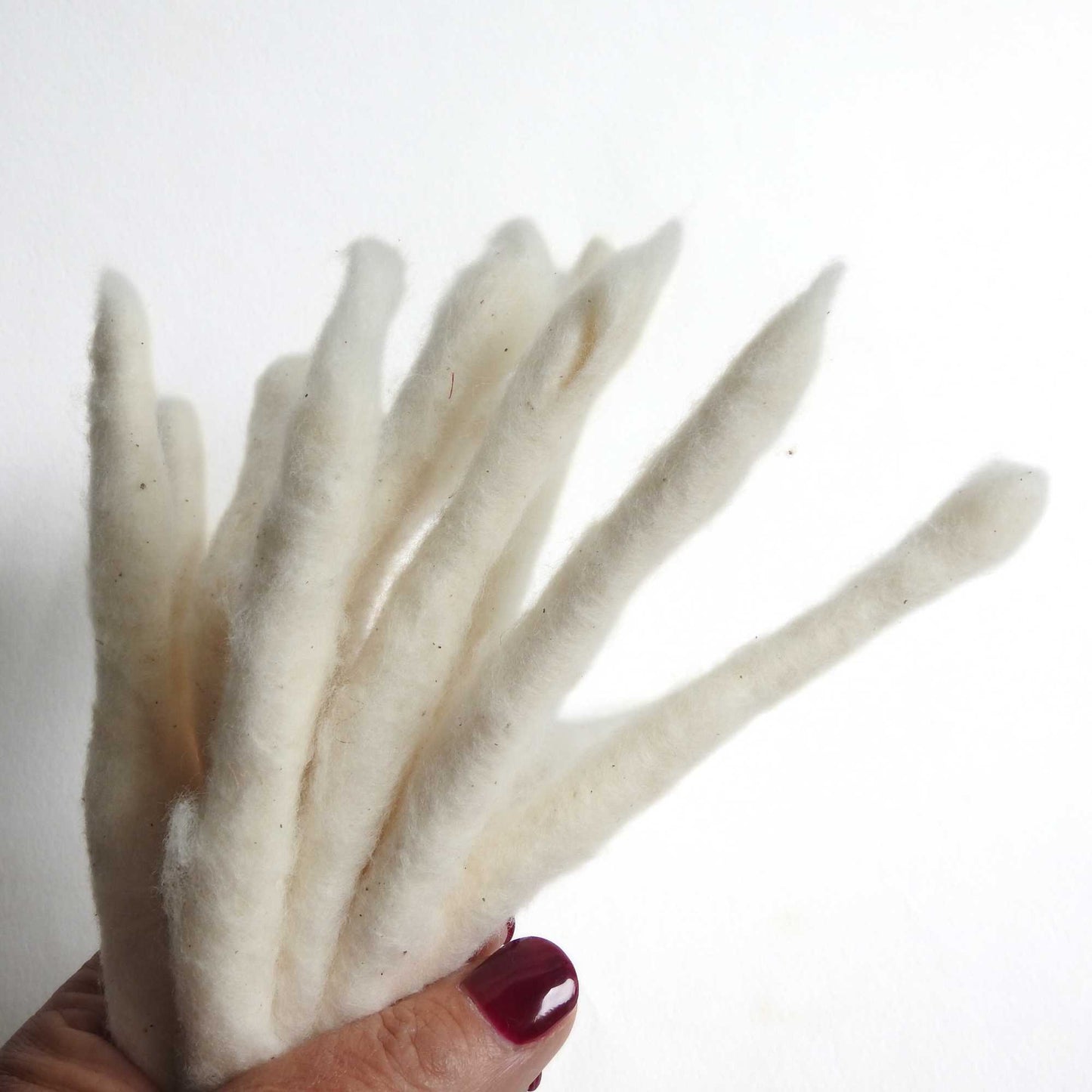 bundle of handspun cotton rolls.  perfect for fibre artists, textile artists, spinning. can be dyed. traditionally known as cotton poonies.