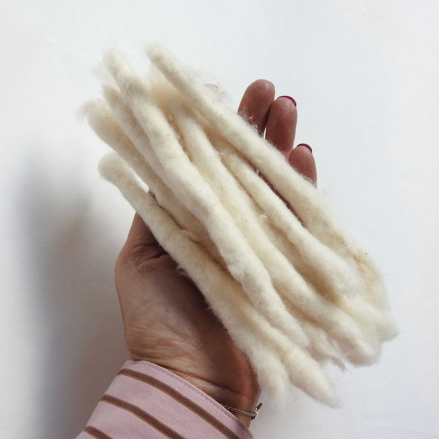 bundle of handspun cotton rolls (cotton poonies).  perfect for fibre artists, textile artists, spinning. can be dyed. traditionally known as cotton poonies.