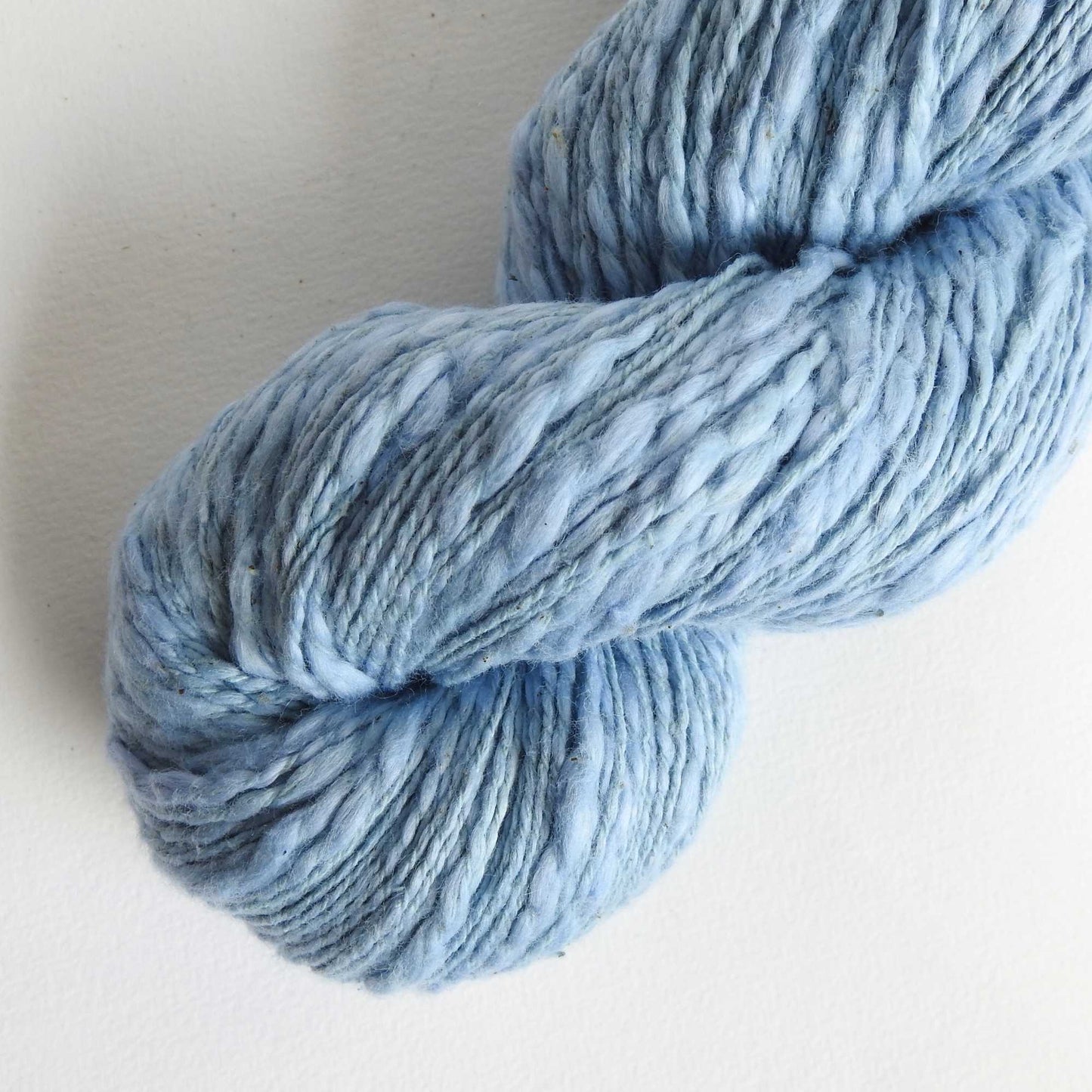 
                  
                    Skein of organic natural Cotton yarn in soft blue. Cotton yarn is super soft with a slight slub for texture. Cotton knitting yarn Australia in off white. For knitting, weaving and crochet
                  
                