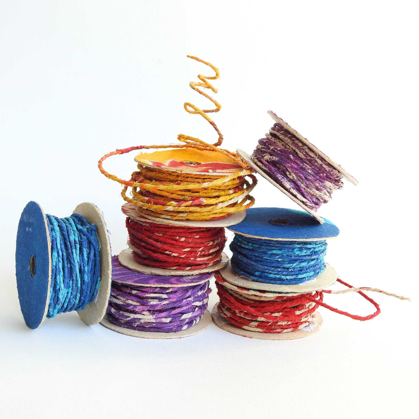 Reels of fairtrade craft wire for beading, craft, amigumuri, flowers, headbands, jewelry. Cloth covered flexible wire. Handmade using upcycled cotton saris. 