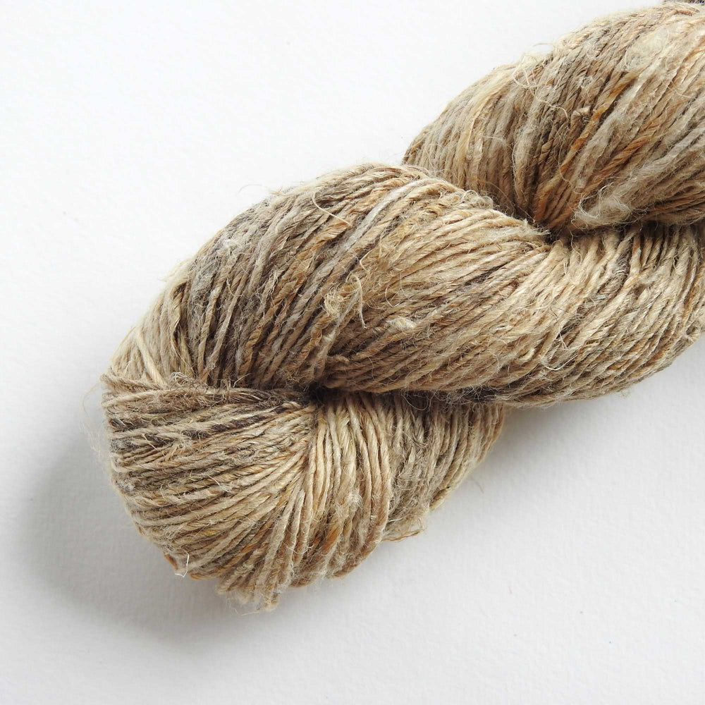A skein of hand spun fine Hemp yarn in Natural.  Natural Hemp is a highly eco friendly fibre and sustainable crop. Knit, crochet or weave with natural Hemp yarn.