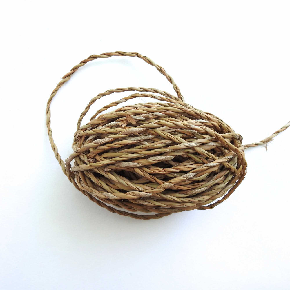 
                      
                        ball of hogla cord, a natural grass harvested and hand produced in bangladesh. sustainably grown. very strong and durable cord
                      
                    