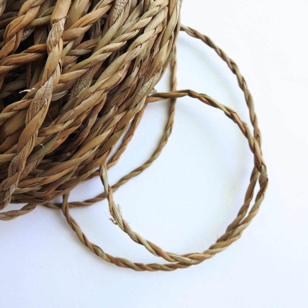 
                      
                        ball of hogla cord, a natural grass harvested and hand produced in bangladesh. sustainably grown. very strong and durable cord
                      
                    