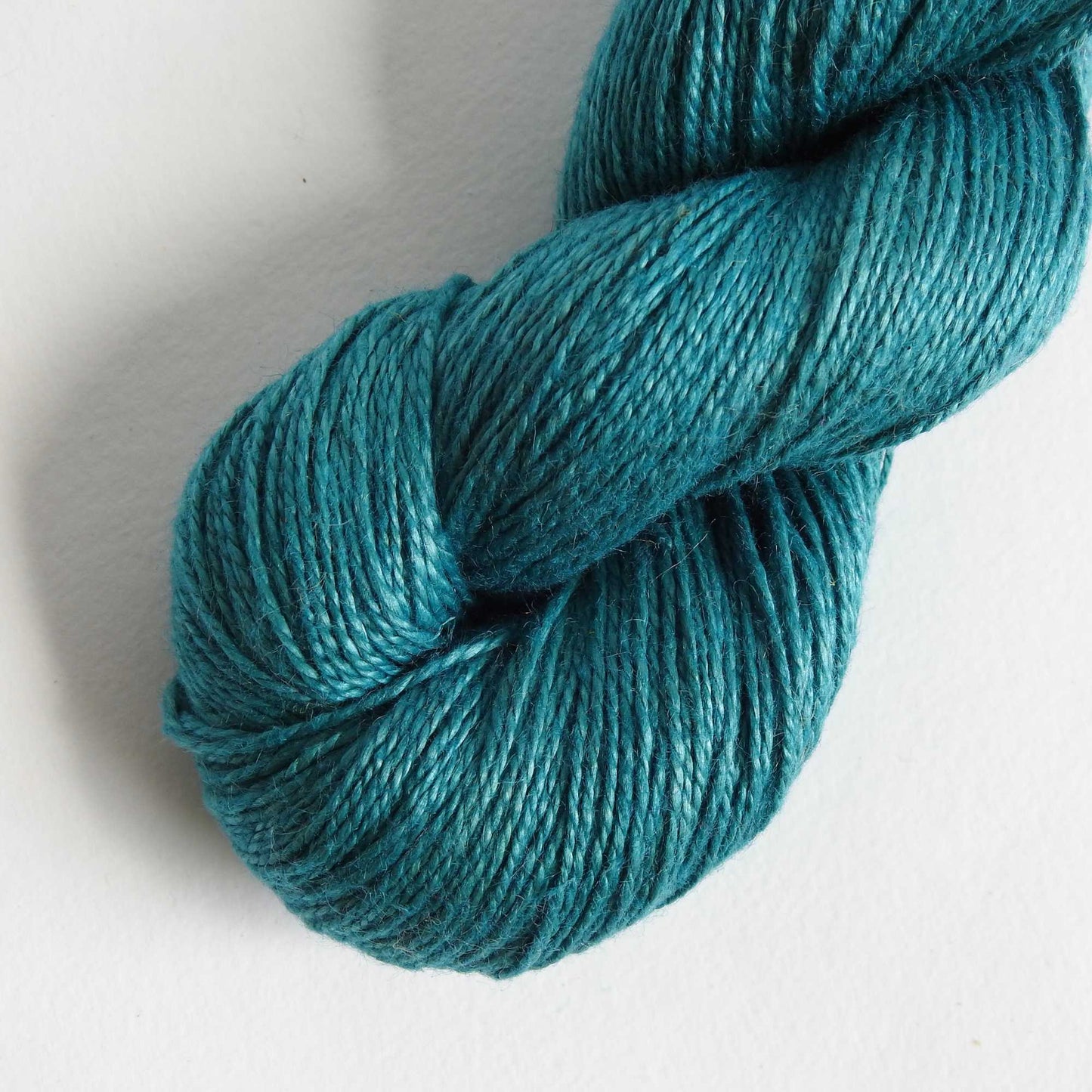 
                  
                    skein of linen yarn in teal. Linen yarn for knitting, weaving, crochet. Natural vegan yarn for summer, baby, socks.
                  
                