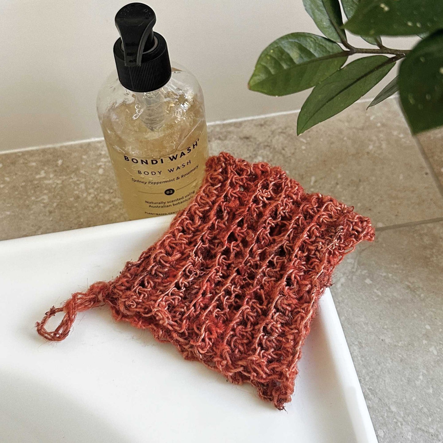 
                  
                    hand crocheted body exfoliating mitt made with nettle in colour amber. gently and naturally exfoliating. plant based fibre. highly sustainable
                  
                