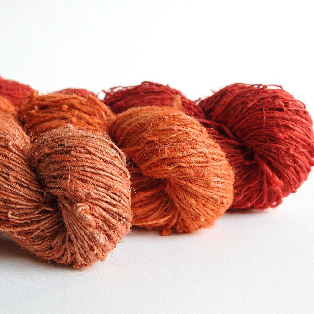 
                  
                    A trio of skeins of Nettle yarn in Amber, Ginger & Poppy.. Nettle is a highly sustainable and eco friendly crop. ORA Fabulous Fibres Nettle yarn is hand spun with a beautiful thick and thin texture giving it a rustic finish. Nettle yarn is available in a range of colours.
                  
                