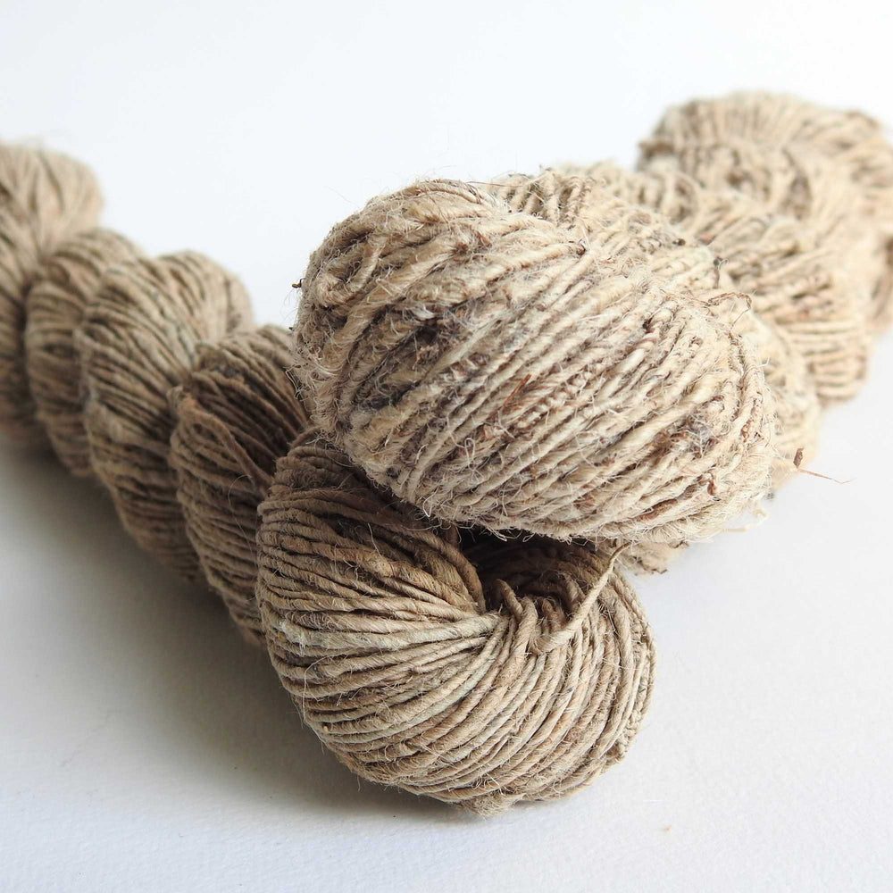 
                  
                    A duo of skeins of Nettle yarn in Natural. Nettle is a highly sustainable and eco friendly crop. ORA Fabulous Fibres Nettle yarn is hand spun with a beautiful thick and thin texture giving it a rustic finish. Nettle yarn is available in a range of colours.
                  
                