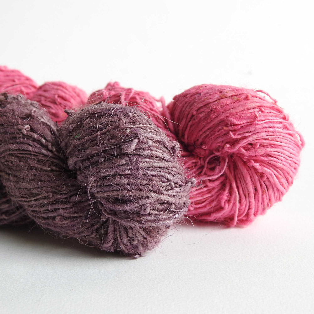 
                  
                    A duo of skeins of Nettle yarn in Grape & Azalea. Nettle is a highly sustainable and eco friendly crop. ORA Fabulous Fibres Nettle yarn is hand spun with a beautiful thick and thin texture giving it a rustic finish. Nettle yarn is available in a range of colours.
                  
                