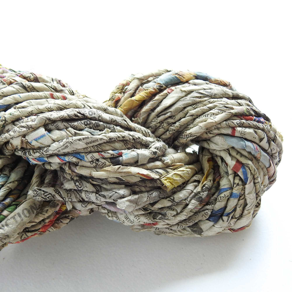 skein of recycled newspaper yarn. hand crafted and sustainable. paper yarn for craft, weaving, crochet, knit, gift wrapping