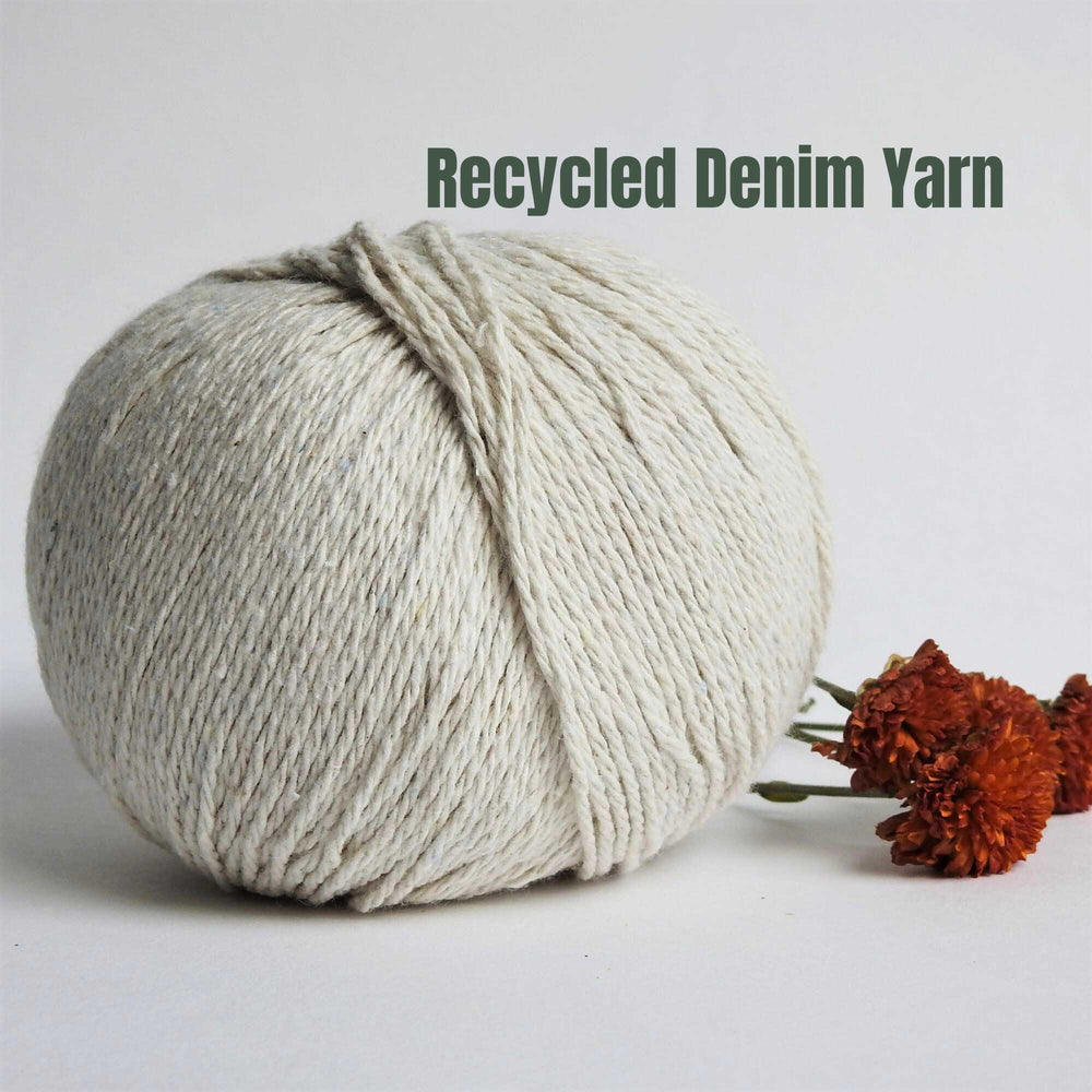 
                  
                    Ball of Chunky Cotton Yarn crafted from recycled denim jeans in colour Natural. Recycled yarn for sweater, scarf, beanie, hat. Natural cotton yarn. Eco Friendly vegan yarn. Pascuali Re-Jeans.
                  
                