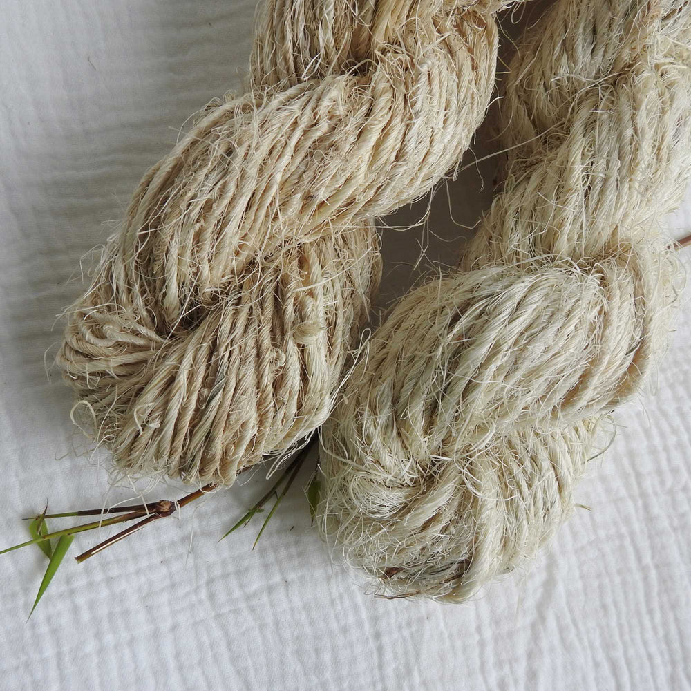 skein of natural pineapple fibre. rustic texture. ideal for baskets, mats, bags, weaving. available in natural and light tones