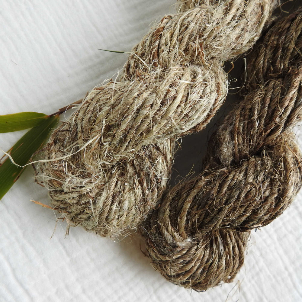 skein of natural ramie fibre. a strong ecofriendly fibre handspun from the bark of the ramie plant. available in natural and light shades. 