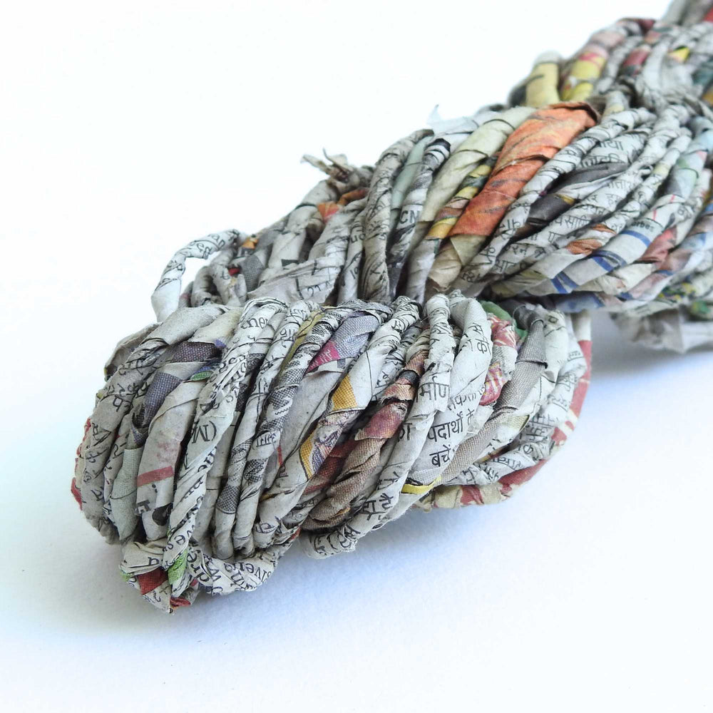 
                  
                    skein of recycled newspaper yarn. hand crafted and sustainable. paper yarn for craft, weaving, crochet, knit, gift wrapping
                  
                