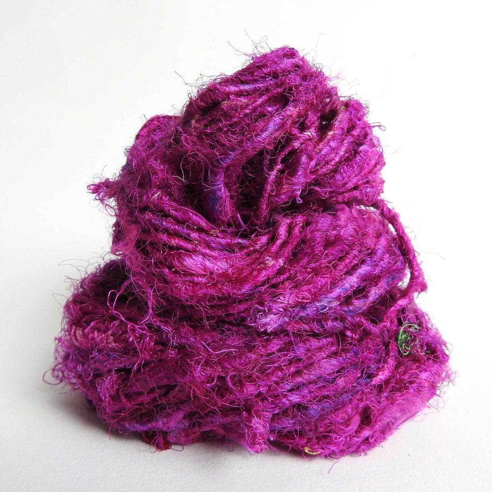 Ball of Sari Silk Yarn in Magenta. Recycled sari silk yarn Australia. Eco friendly yarn. Handspun, chunky yarn for knitting, crochet, weaving, craft.