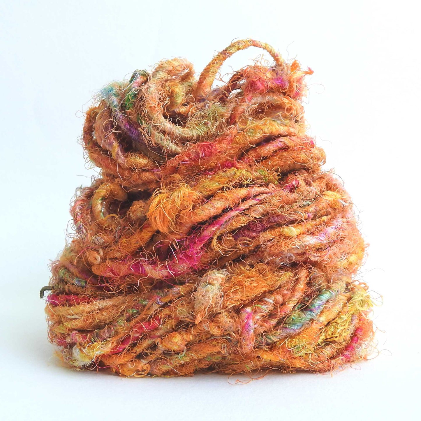 
                  
                    Ball of Sari Silk Yarn in Orange. Recycled sari silk yarn Australia. Eco friendly yarn. Handspun, chunky yarn for knitting, crochet, weaving, craft.
                  
                