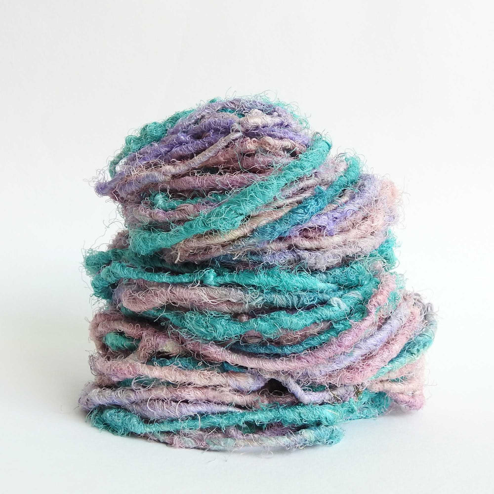 
                  
                    Ball of Sari Silk Yarn in Purple Rain. Recycled sari silk yarn Australia. Eco friendly yarn. Handspun, chunky yarn for knitting, crochet, weaving, craft.
                  
                