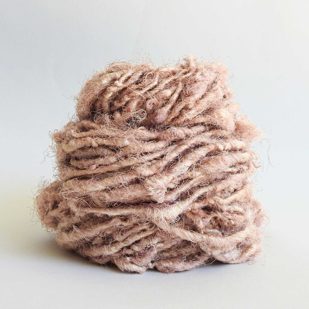 
                  
                    Ball of Sari Silk Yarn in Sand. Recycled sari silk yarn Australia. Eco friendly yarn. Handspun, chunky yarn for knitting, crochet, weaving, craft.
                  
                
