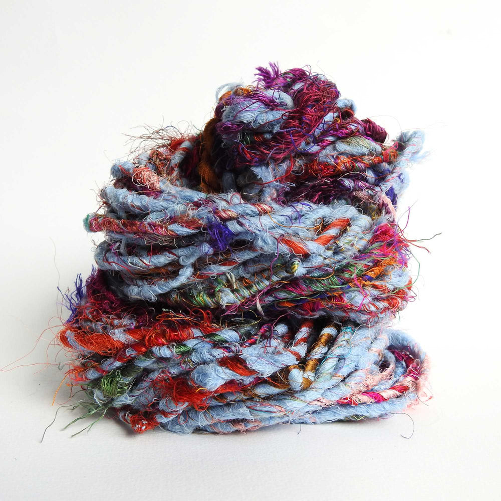 Ball of Recycled wool and silk yarn in blue. Soft, thick yarn for weaving, knitting, crochet and macrame. Hand spun, chunky natural yarn.