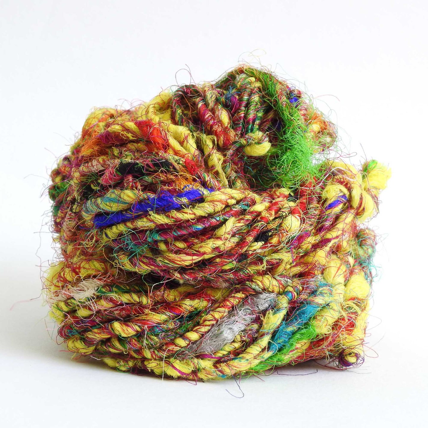 
                  
                    Ball of Recycled wool and silk yarn in yellow. Soft, thick yarn for weaving, knitting, crochet and macrame. Hand spun, chunky natural yarn.
                  
                
