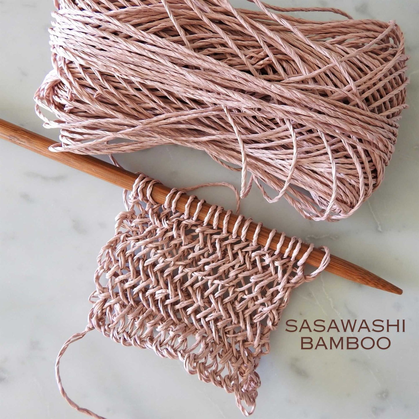 
                  
                    Knitted swatch using Sasawashi Bamboo Paper yarn in shell pink. Daruma Bamboo yarn for summer hats, bags, baskets. Eco friendly, vegan yarn for weaving, knitting, crochet, craft. Daruma Ito Yokota Sasawashi.
                  
                