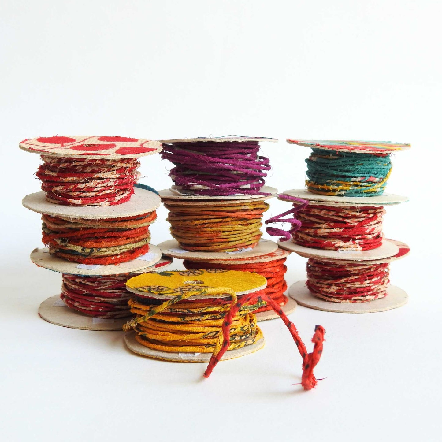 Reels of fairtrade craft wire for beading, craft, amigumuri, flowers, headbands, jewelry. Cloth covered flexible wire. Handmade using upcycled cotton saris. 