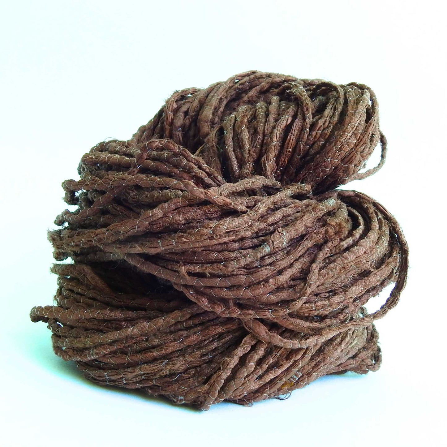 skein of upcycled sari cord in chocolate. a matt silk cord, hand twisted and ideal for crafting hats, bags etc. 