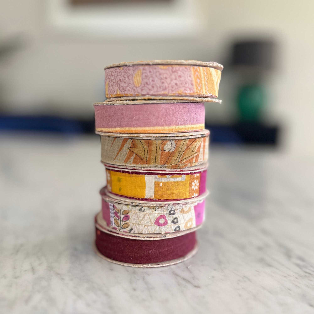 
                      
                        spools of upcycled sari cotton ribbon for weaving, baskets, trim, hair, hats, bags. Assorted colours and patterns. Crafted from upcycled sari cotton.
                      
                    