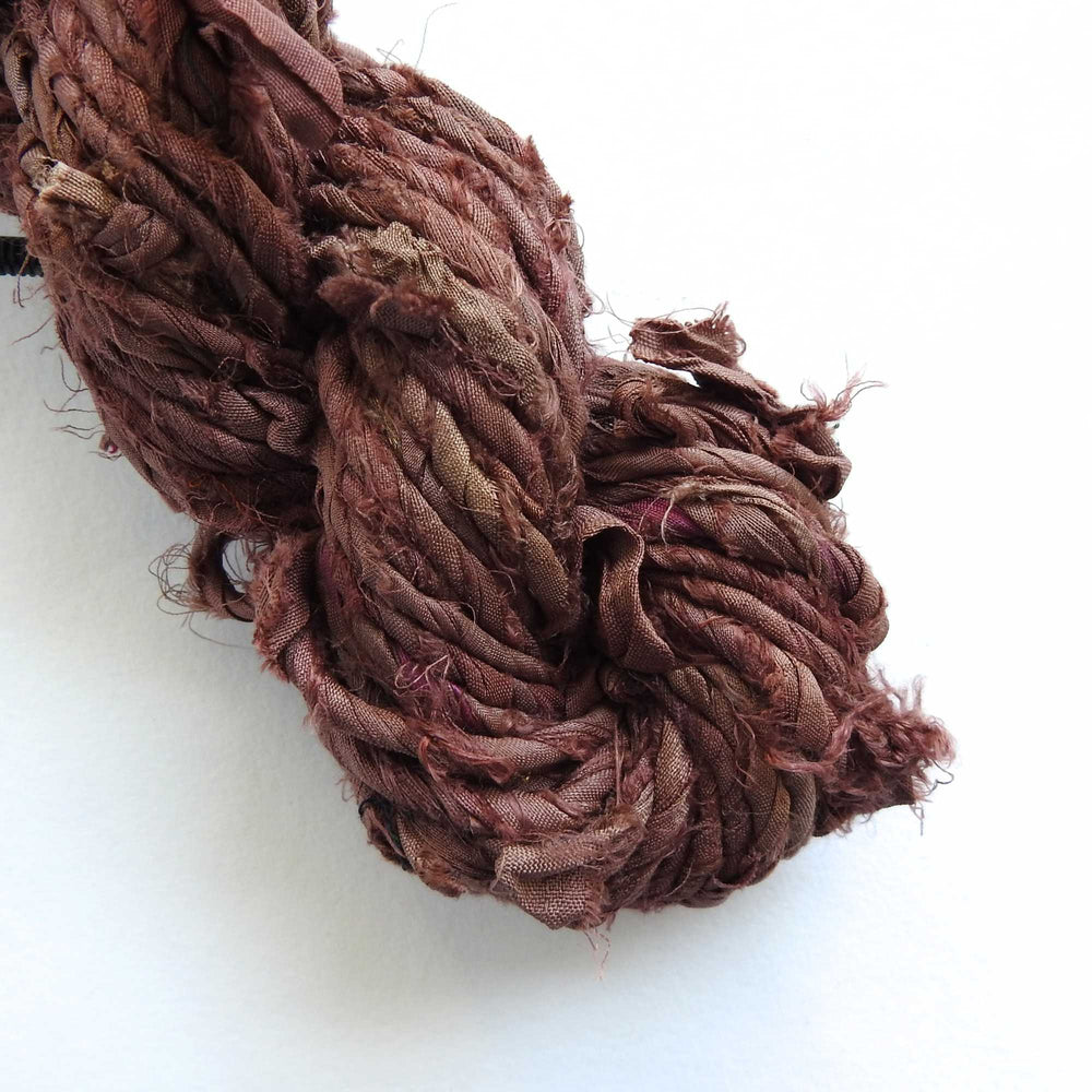 
                  
                    skein of upcycled sari cord in chocolate. a matt silk cord, hand twisted and ideal for crafting hats, bags etc. 
                  
                