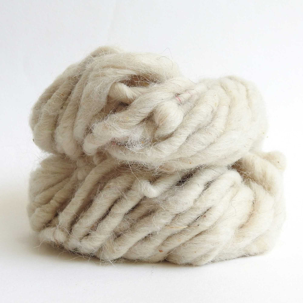 skein of natural wool yarn. chunky wool yarn for macrame, weaving, crafts. hand spun with thick and thin texture. strong and durable. new zealand wool yarn. 