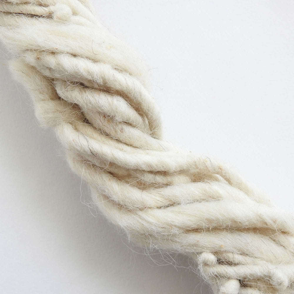 
                  
                    skein of natural wool yarn. chunky wool yarn for macrame, weaving, crafts. hand spun with thick and thin texture. strong and durable. new zealand wool yarn. 
                  
                