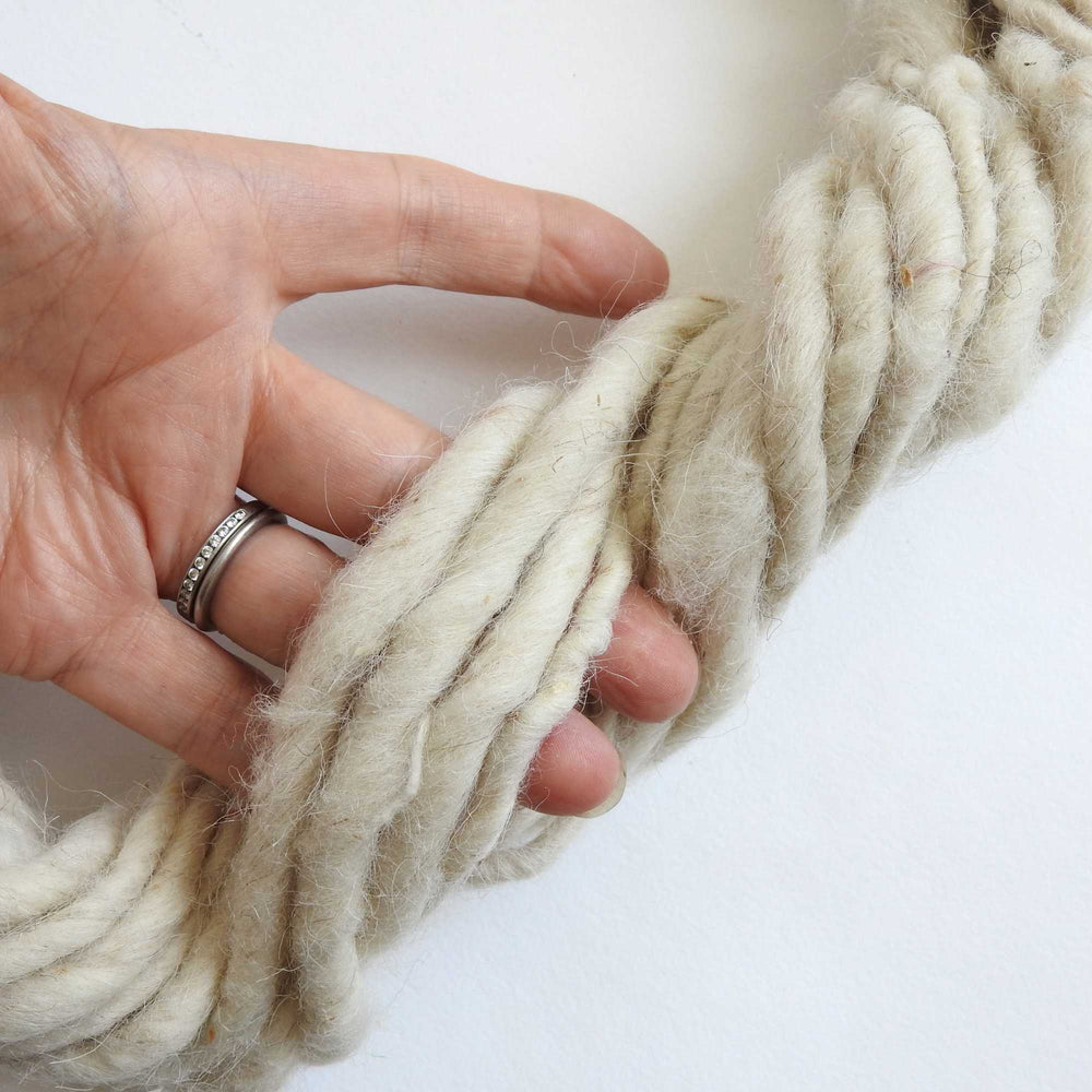 
                  
                    skein of natural wool yarn. chunky wool yarn for macrame, weaving, crafts. hand spun with thick and thin texture. strong and durable. new zealand wool yarn. 
                  
                